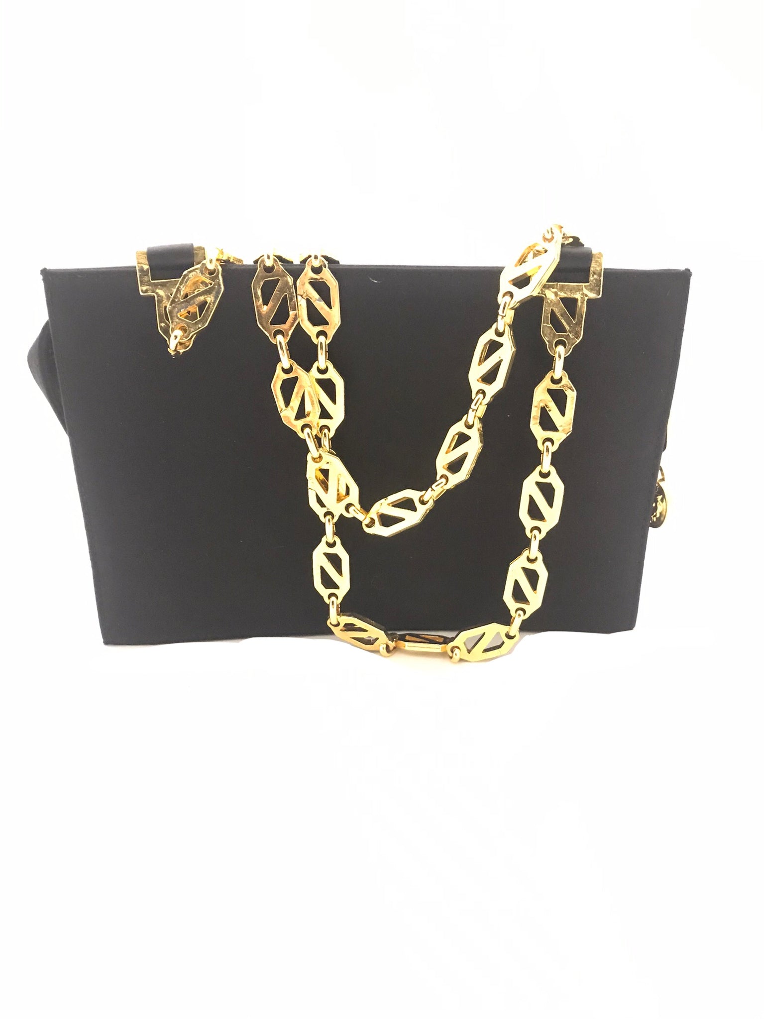 Isabella's Wardrobe Versus Versace Vintage Lion's Head Evening Bag.