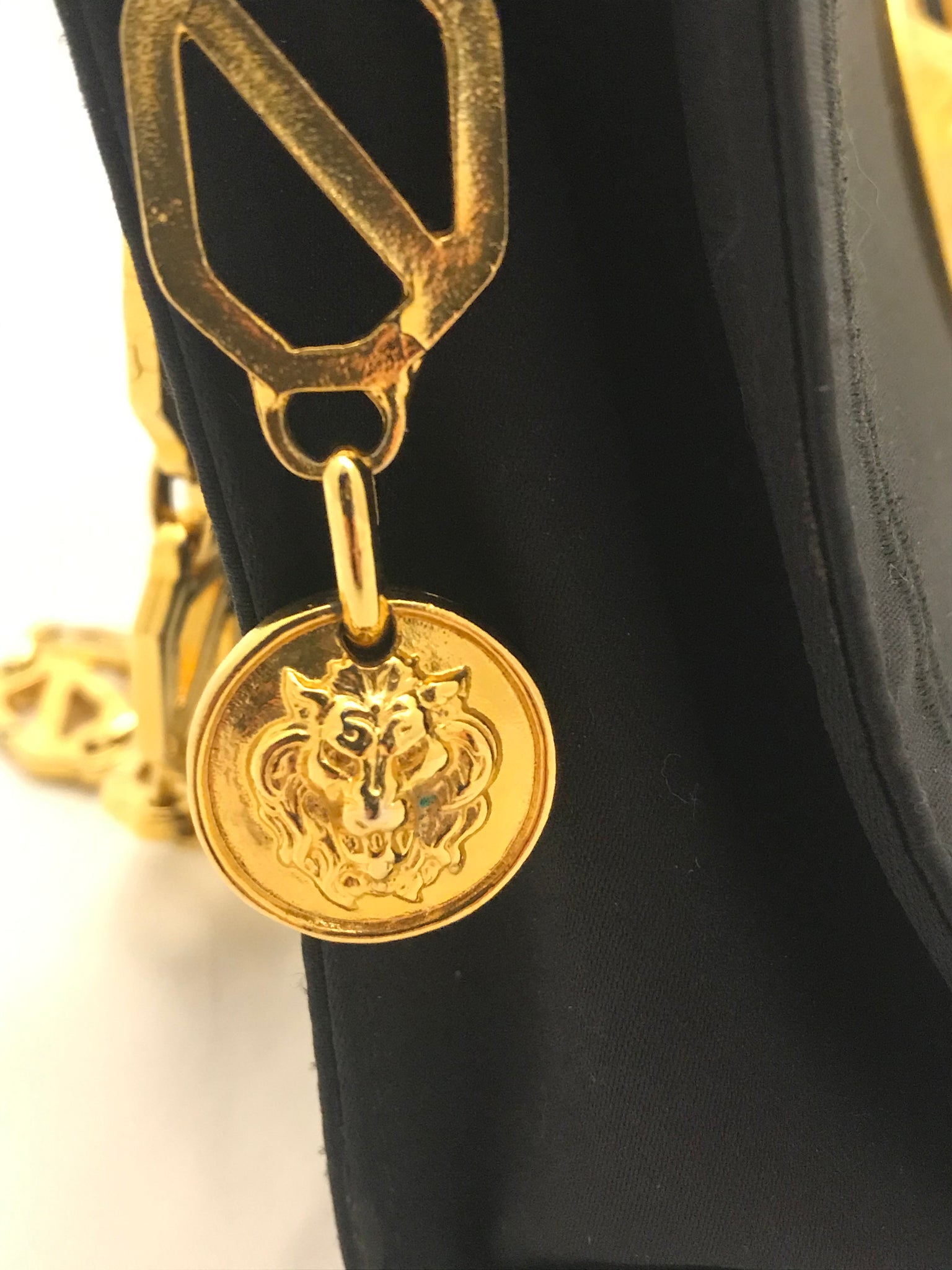 Isabella's Wardrobe Versus Versace Vintage Lion's Head Evening Bag.