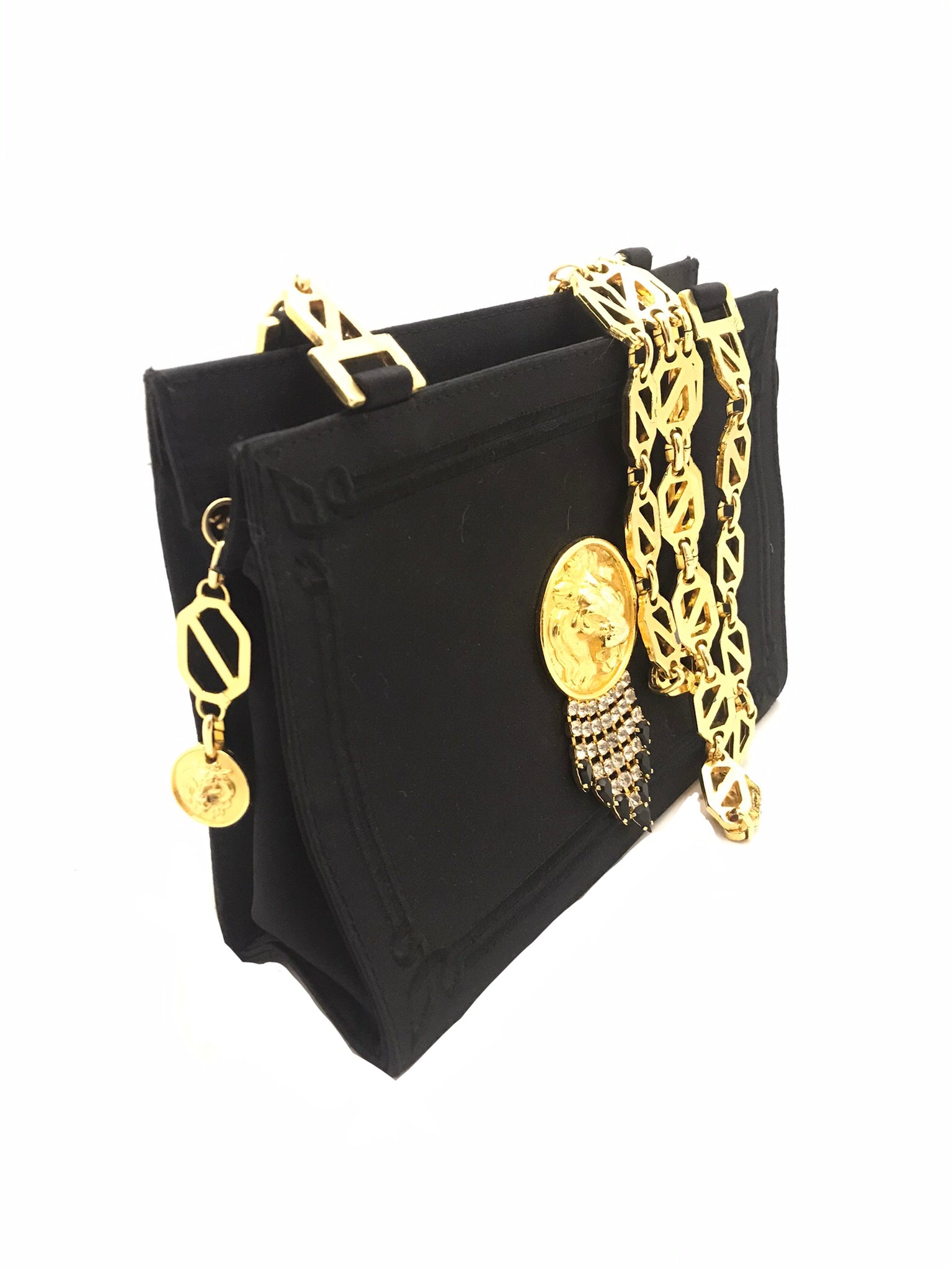 Isabella's Wardrobe Versus Versace Vintage Lion's Head Evening Bag.