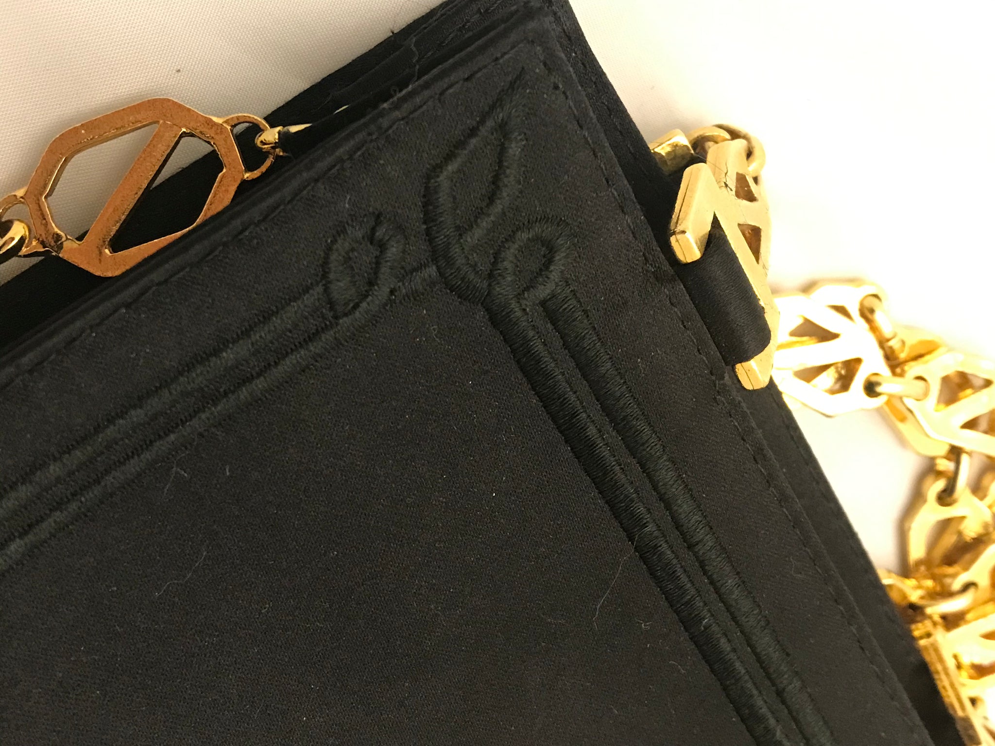 Isabella's Wardrobe Versus Versace Vintage Lion's Head Evening Bag.